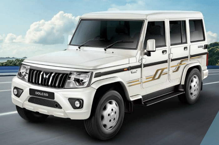 Maruti Ertiga Mahindra Bolero white color