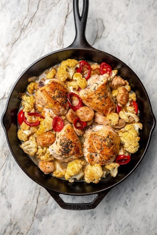 Cauliflower and chicken breasts make this Chicken Scarpariello recipe low carb, but it's just as spicy and flavorful as the classic version! Chicken scarpariello in cast iron skillet.
