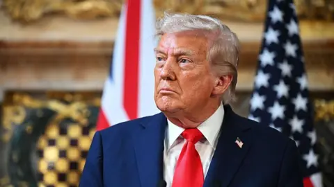 Getty Images A close up image of US President Donald Trump as he attends a press conference on 18 September  in Aylesbury, England.