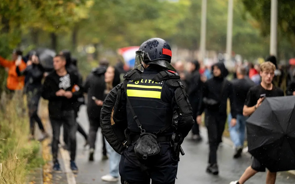 Police on the A12 motorway after protesters took to the road during a protest against the current asylum policy at the Malieveld, in the Hague, the Netherlands, 20 September 2025