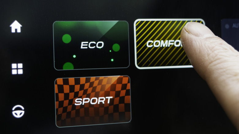 A close-up of drive mode selection options on a vehicle touchscreen.